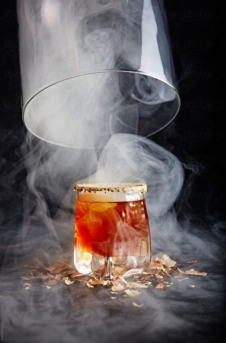 Smoked signature cocktail served under a glass cloche